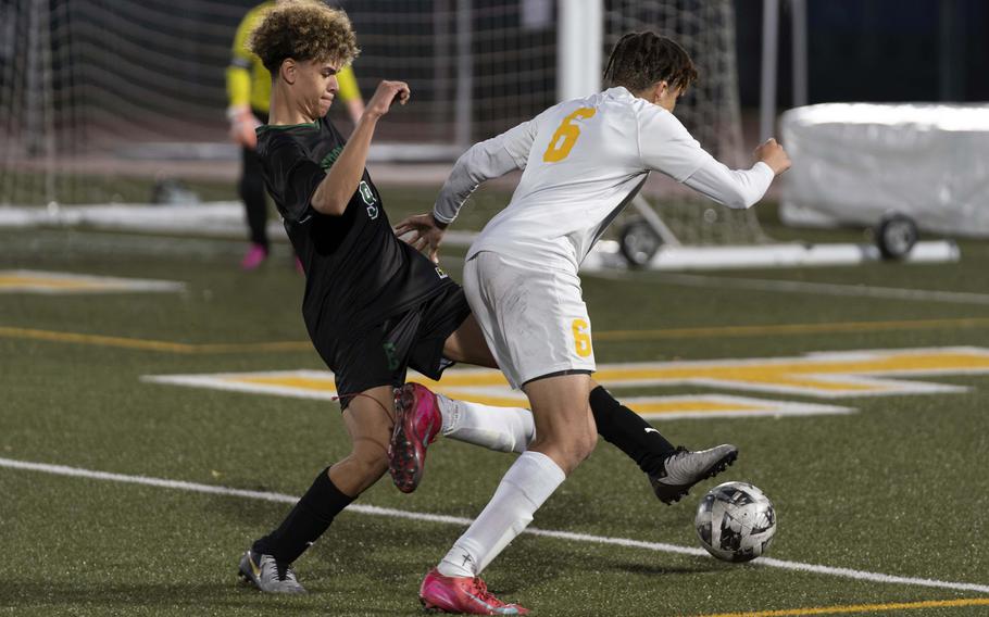 Sam Tokiyoshi-Gray tries to maintain possession.