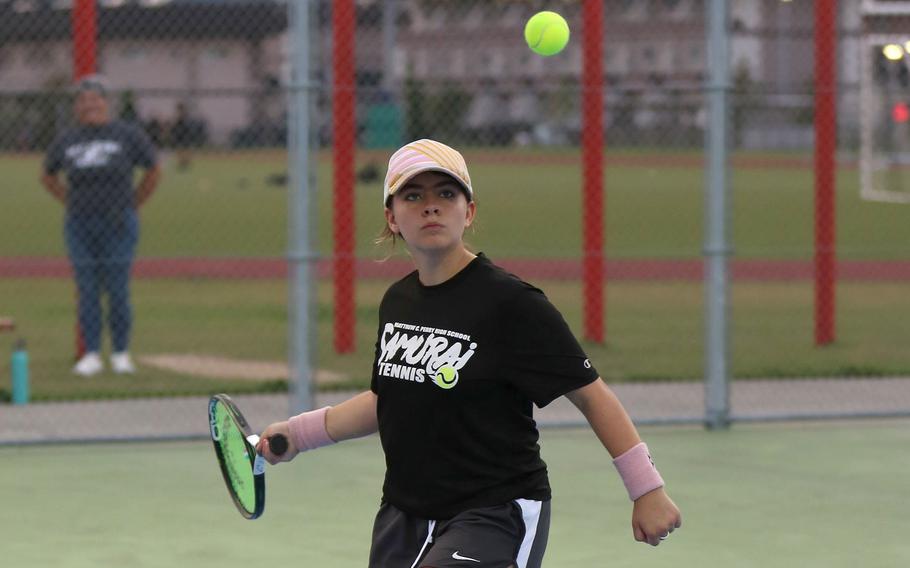 Matthew C. Perry's Ren Foslin prepares for a forehand return against E.J. King. Foslin won her singles match.