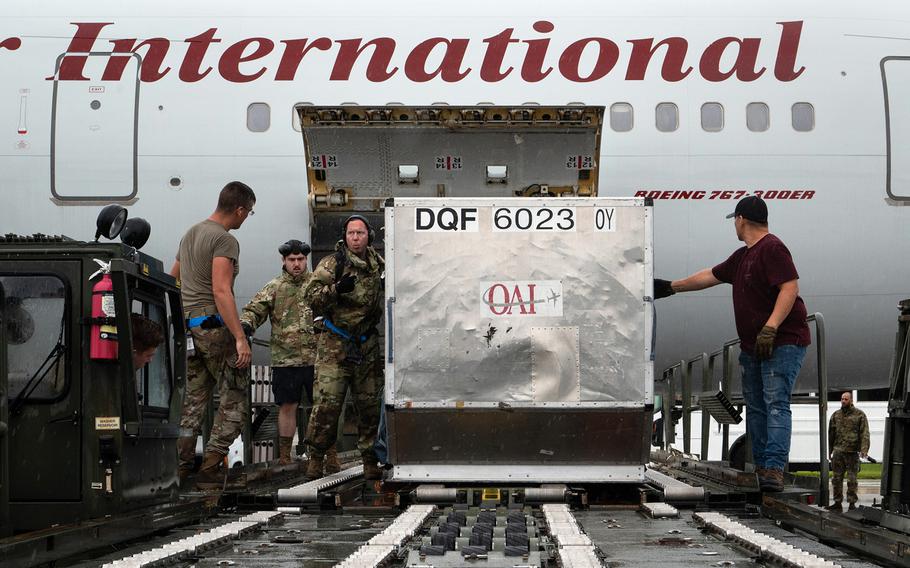 Members of the 734th Air Mobility Squadron prepare the Patriot Express for departure at Andersen Air Force Base, Guam, May 30, 2023.