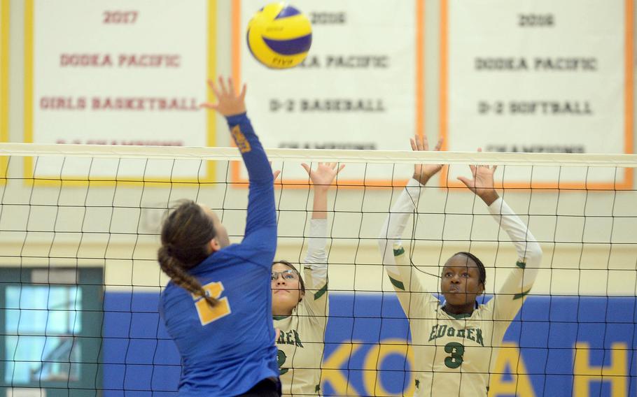 Yokota's Malia Hutchins spikes against Robert D. Edgren's Alyssa Marrero and Anaiah Cain during Saturday's DODEA-Japan girls volleyball matches. The Panthers won in three sets Saturday and four Friday.