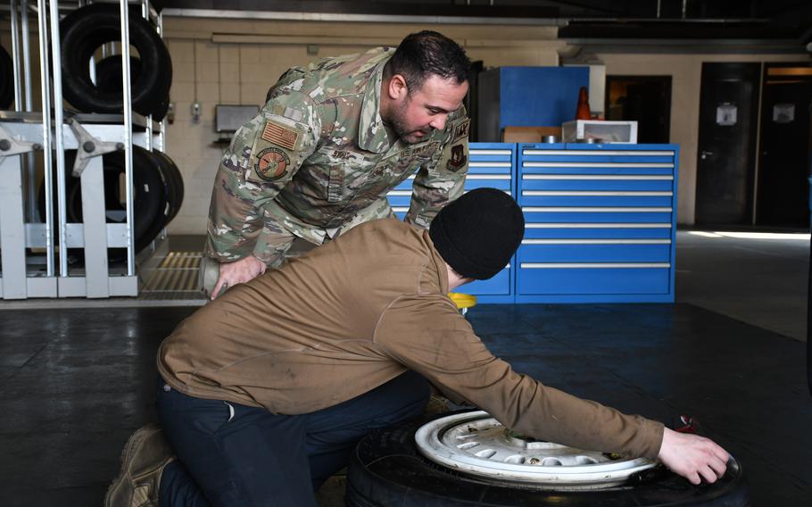 Tech. Sgt. Matthew Byous answers a question from an airman about fixing equipment at RAF Lakenheath, England, March 24, 2022. Byous, a third-generation airman, has been part of a working group seeking ways to help commanders and subordinates better communicate.  