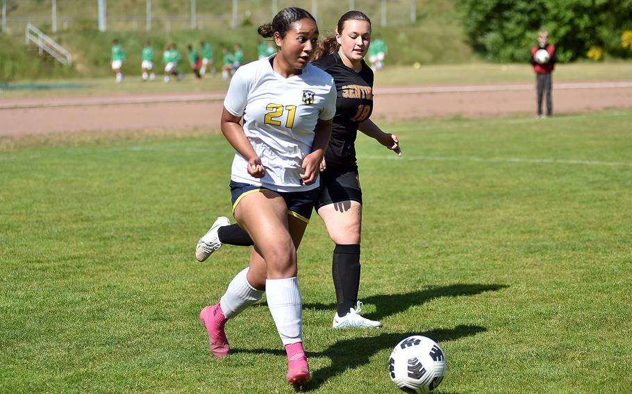 Ansbach left back Oli Cormier dribbles back against Spangdahlem defender Lauren Weyland during the second day of round-robin action at the 2025 Division III DODEA European championships on May 20, 2025, at Rothenborn Stadion in Landstuhl, Germany.