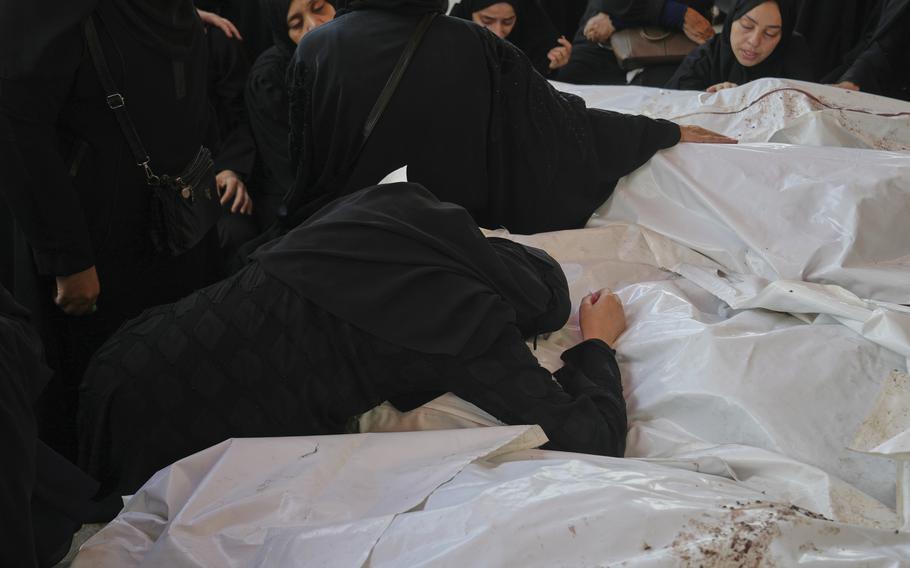 People mourning the death of their relatives.
