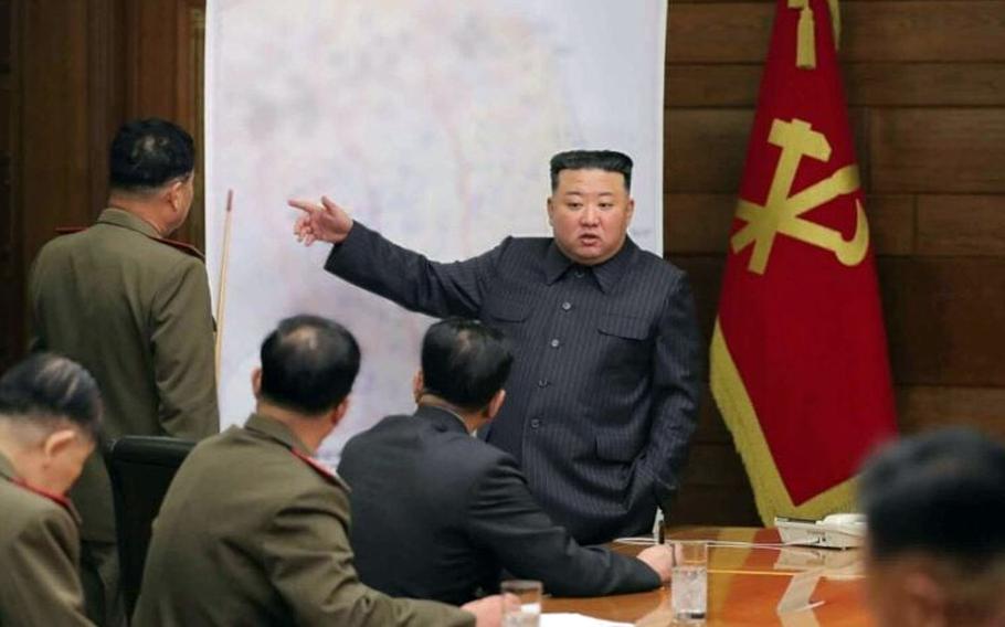 North Korean leader Kim Jong Un appears to point to a spot south of South Korea's capital in this image released by the state-run Rodong Sinmun newspaper on April 11, 2023.