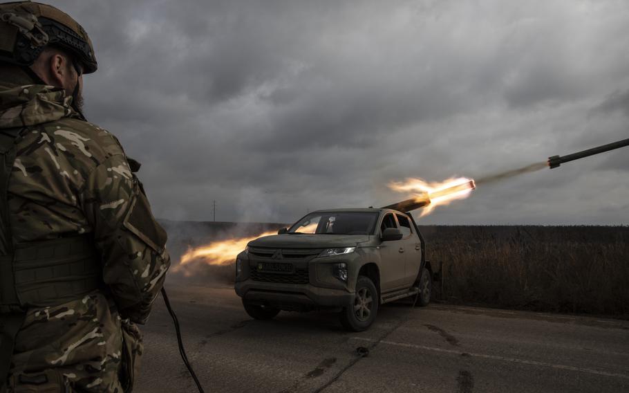 Soldiers in Ukraine's Karlson unit fire a Grad rocket at a Russian position in the Kherson region of southern Ukraine on Oct. 27, 2022. 