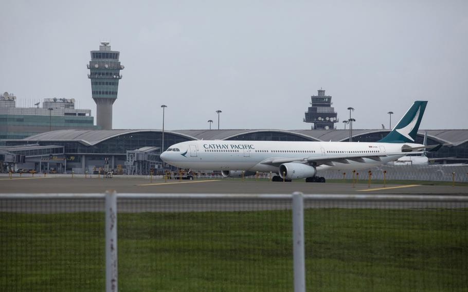 An aircraft operated by Cathay Pacific Airways is seen at Hong Kong International Airport in Hong Kong on Aug. 10, 2021. 