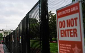 A close-up of a fence with a “Do not enter” sign on it.
