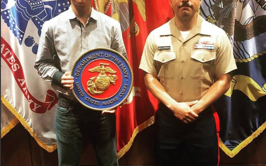 Staff Sgt. Joseph Maldonado, right, answered a California crash victim’s call for help Dec. 6 and gave police information that may have helped the victim survive.