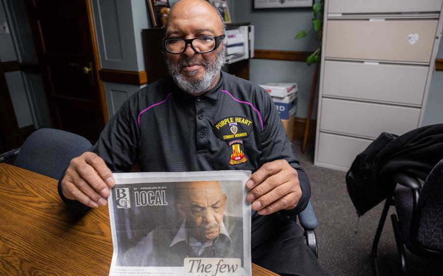 Thomas M. Belton shows an article featuring his cousin Harold Phillips, who was one of the first African Americans to serve in the U.S. Marine Corps who received the Congressional Gold Medal. Belton has been Springfield’s Director of Veterans Services since 2011.