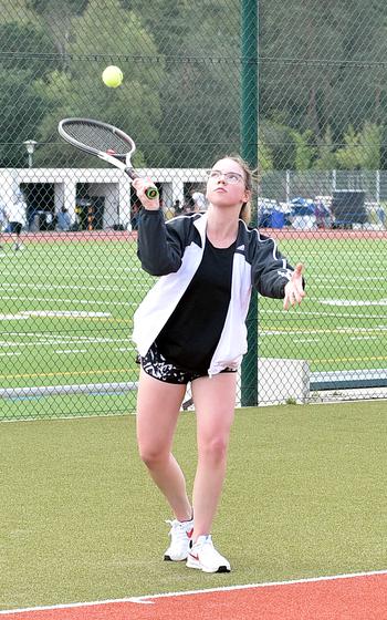 Royal tennis player Madelyn Knepper serves during a practice on Aug. 29, 2023, at Ramstein High School on Ramstein Air Base, Germany.