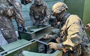 South Korean soldiers inspect loudspeaker equipment at an unspecified location near the Demilitarized Zone, June 9, 2024.
