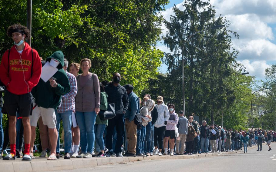 Hundreds of families line up for the COVID-19 vaccine at Patch Barracks in Stuttgart, Germany, May 22, 2021.  Nearly three-quarters of the U.S. Army community in Europe and Africa are fully vaccinated and 77% of 16- and 17-year-old military children overseas have been inoculated against the coronavirus, health officials say.