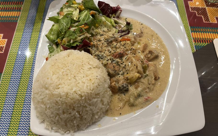 A plate of food and rice at Quagies in Kaiserslautern, Germany.