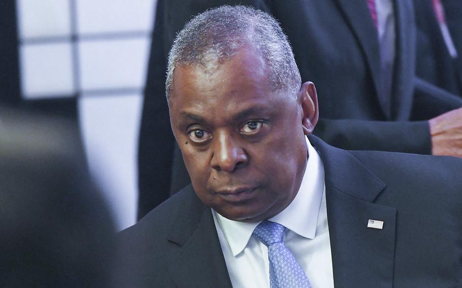 U.S. Defense Secretary Lloyd Austin listens to China’s Defense Minister Wei Fenghe at the ministerial roundtable luncheon at the Shangri-La Dialogue summit in Singapore on June 11, 2022. 