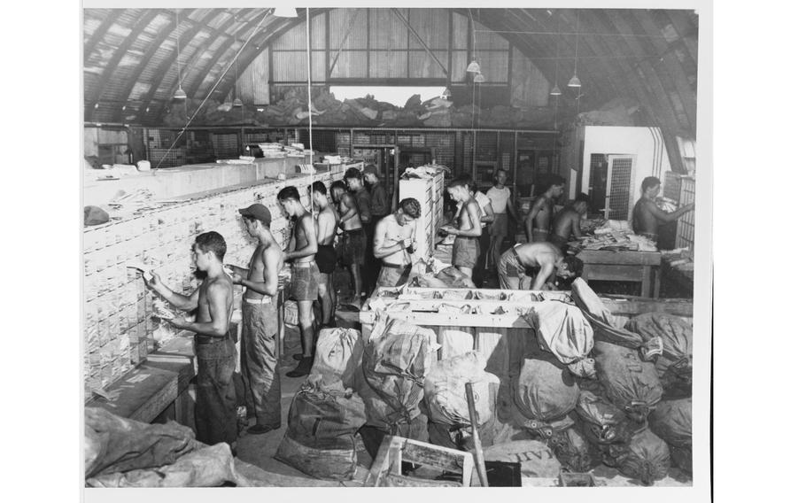 People sorting mail.