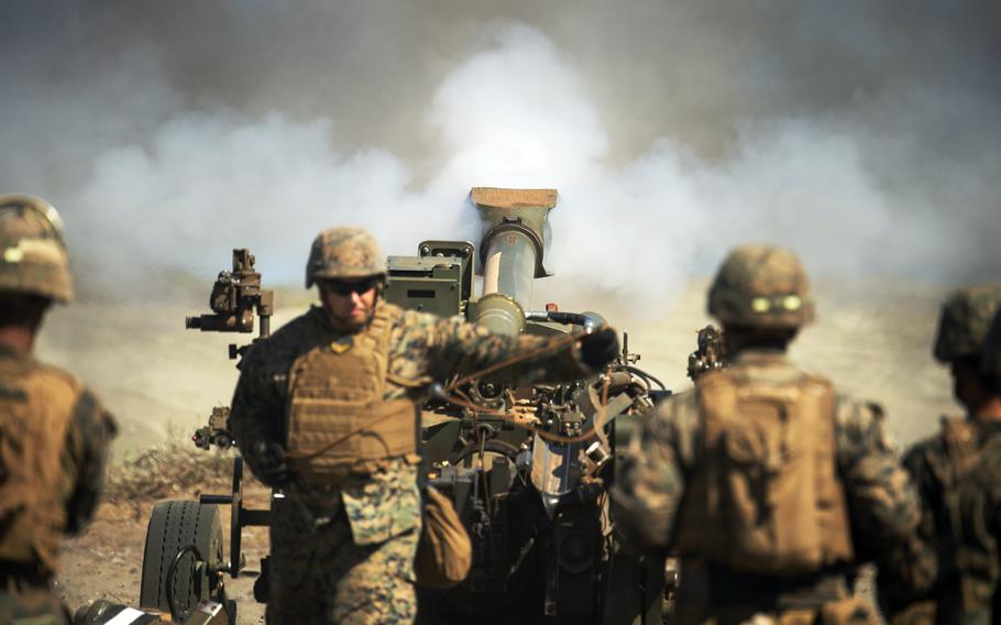 Marines and sailors with the 3rd Marine Littoral Regiment fire an M-777 howitzer during a Balikatan drill at the La Paz Sand Dunes in Laoag, Philippines, May 6, 2024.