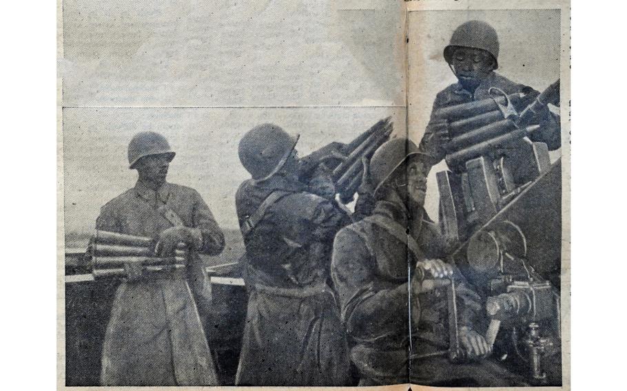 “Ack-ack men consider business good when they must pour clips of 40mm of ‘food’ into their guns,” read the original caption on this image, first published in the Northern Ireland edition of Stars and Stripes Feb. 10, 1944. The photograph shows three troops loading ammunition into a 40mm Bofors anti-aircraft gun, as another mans the controls. 