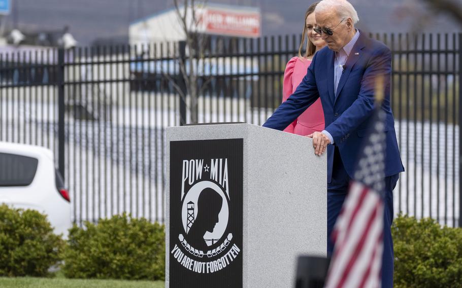 President Joe Biden, and Scranton Mayor Paige Cognetti, pause at a Scranton war memorial, Wednesday, April 17, 2024, in Scranton, Pa. 