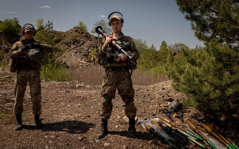 Members of a Zaporizhzhia territorial defense battalion take part in weapons training at a site in the Zaporizhzhia Oblast, Ukraine, on Wednesday, May 11, 2022.