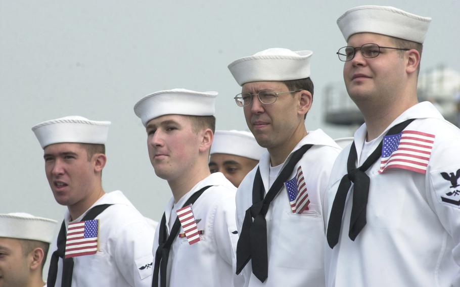 Kitty Hawk sailors look on as their homeport in Yokosuka comes into view Tuesday morning, May 6, 2003.