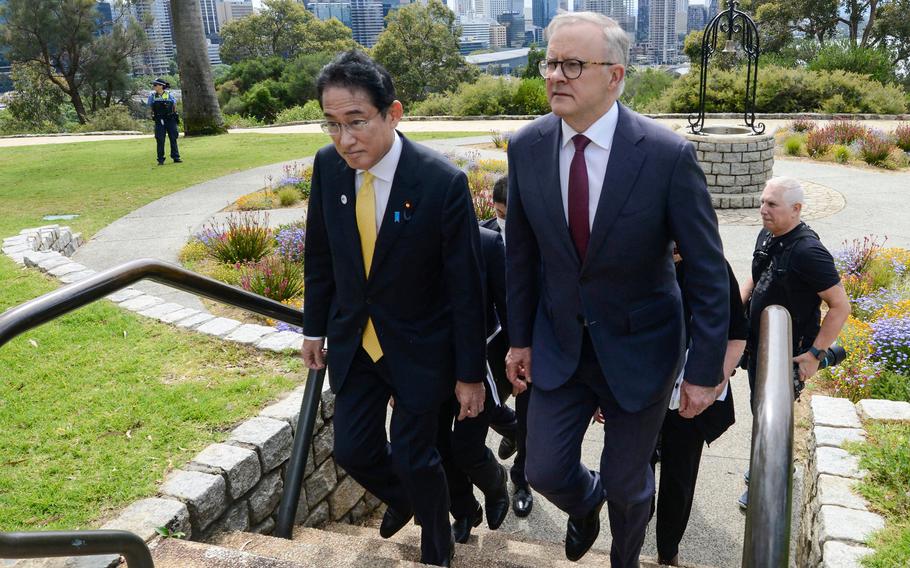 Australia's Prime Minister Anthony Albanese, right, walks with Japan's Prime Minister Fumio Kishida in Kings Park in Perth, Australia, on Oct. 22, 2022. 