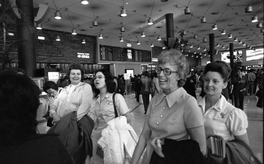 A group of women arrive at Yokota Air Base
