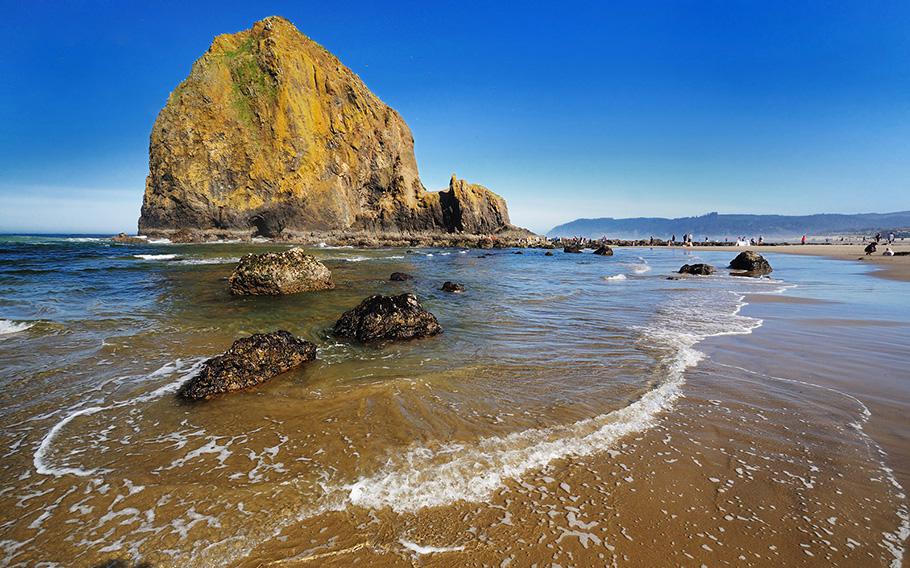 Haystack Rock in Oregon. Officials closed Cannon Beach near Haystack Rock over the weekend after a cougar sighting.
