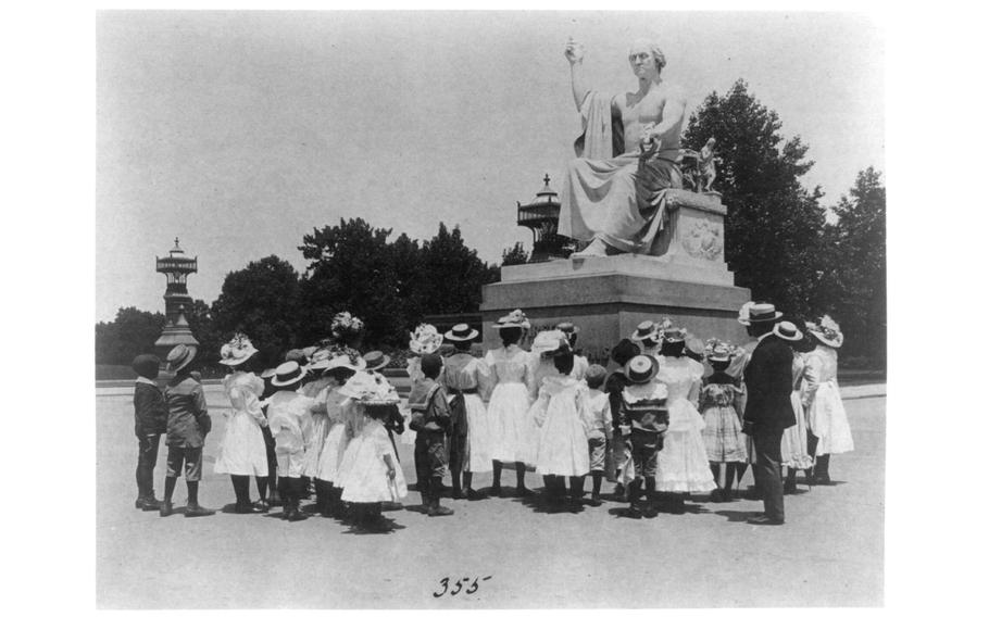 African American schoolchildren facing the Greenough statue of Washington at the U.S. Capitol, circa 1899. 