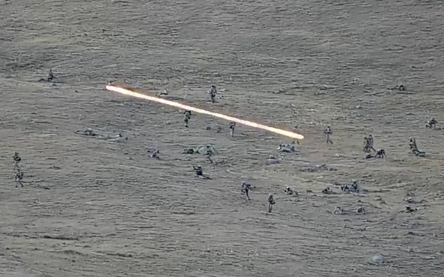 In this image taken from a YouTube footage released by Armenian Defense Ministry on Tuesday, Sept. 13, 2022, shows Azerbaijanian servicemen crossing the Armenian-Azerbaijani border and approaching the Armenian positions. Armenia’s prime minister says that 49 soldiers have been killed in nighttime attacks by Azerbaijan.