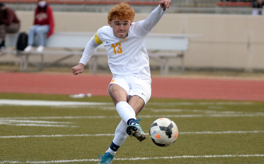 Yokota’s Owen Taylor launches the second of his two goals against Zama during Friday’s Perry Cup soccer matches. The Panthers won 3-1.