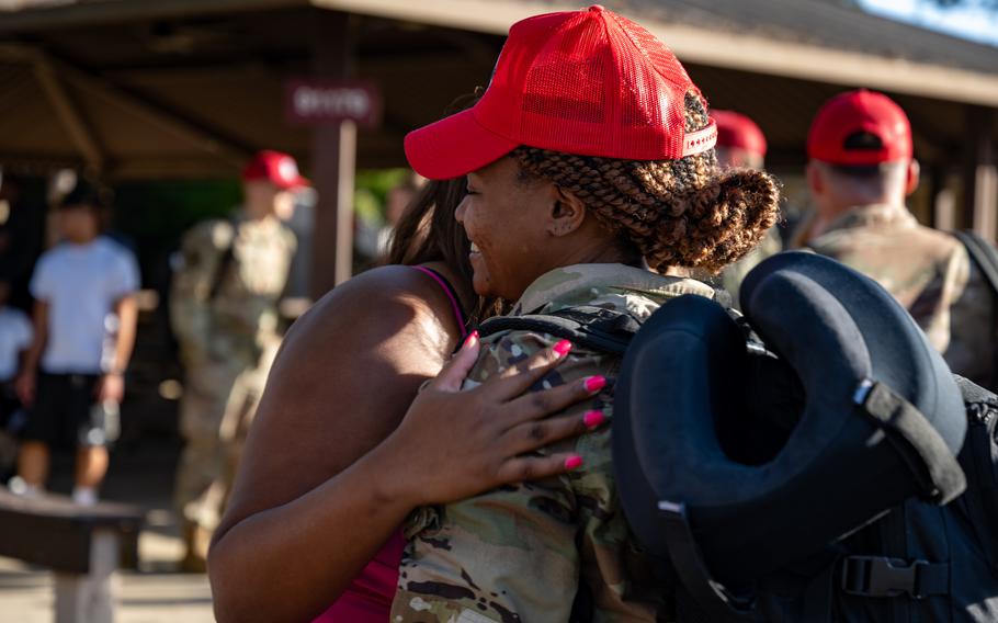 A U.S. Air Force airman assigned to the 823rd Rapid Engineer Deployable Heavy Operational Repair Squadron Engineer reunites with his family at Hurlburt Field, Fla., Sunday, April 14, 2024. 