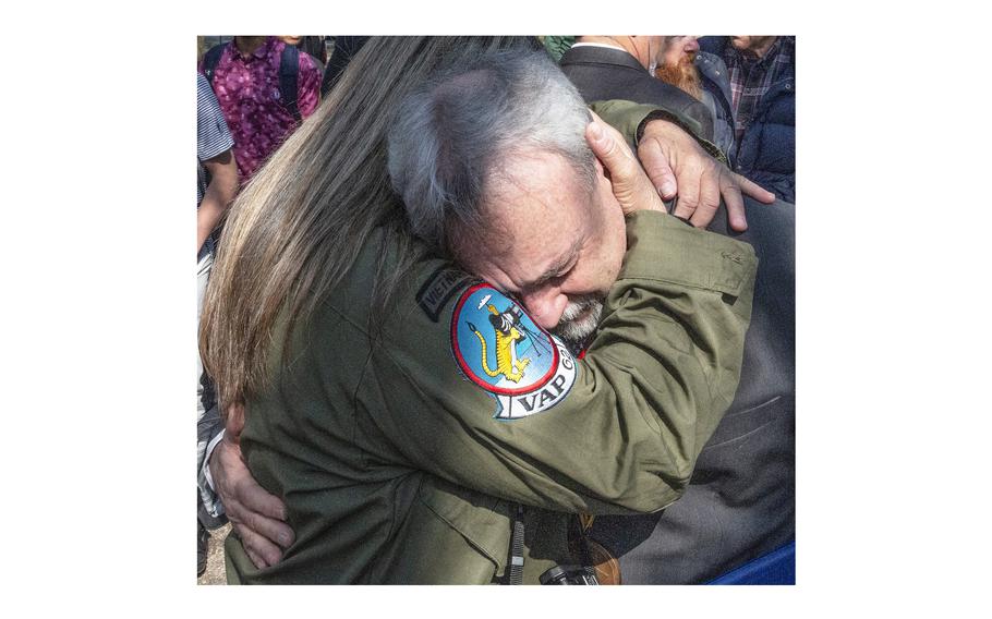 Rick Holland, whose father, Tech Sgt. Melvin Holland, remains unaccounted for decades after a March 11, 1968 North Vietnamese attack on a U.S. Air Force Tactical Air Navigation system facility in Laos, is overcome with emotion after a National Vietnam War Veterans Day ceremony Friday in Washington.