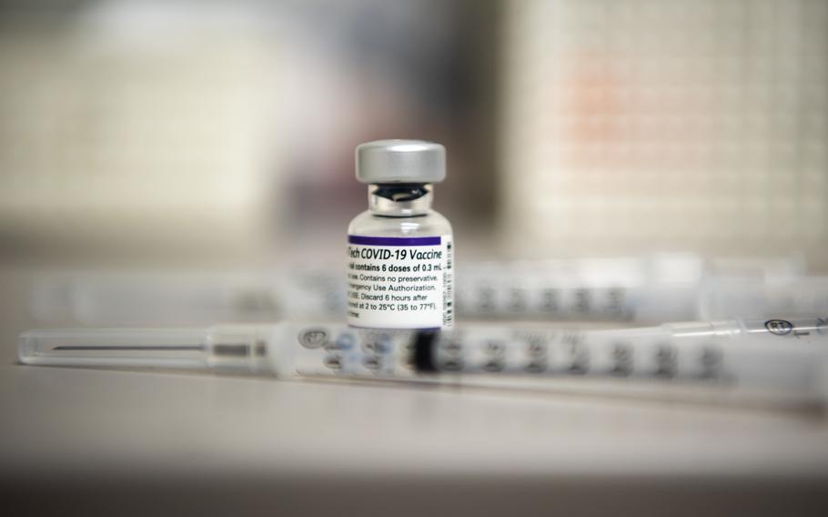 Syringes surround a vial of the COVID-19 vaccine before being administered at the Kadena Immunization Clinic at Kadena Air Base, Japan, Jan. 26, 2022.