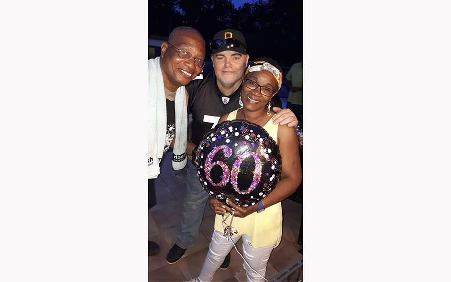 Flossie Adams, right, Ronny Coleman and Adams’ husband, Coach Thomas Adams, photographed before Coleman’s death. 