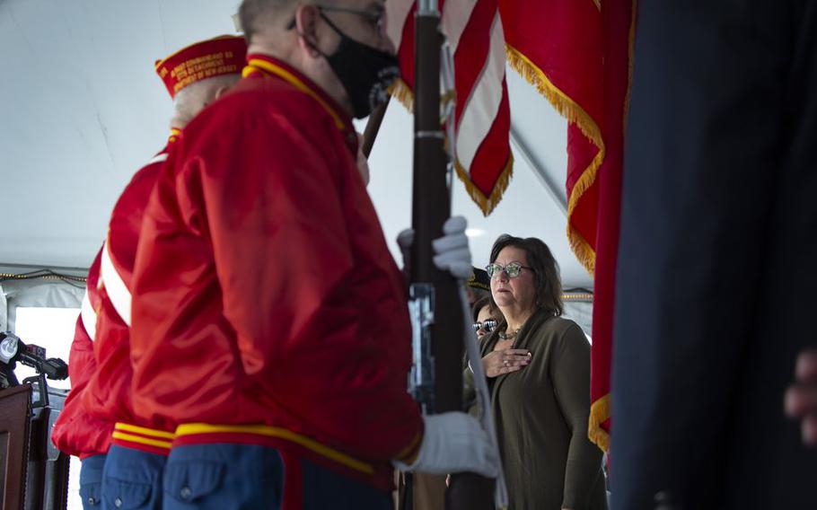 Camden Commissioner Melinda Kane, right, holds her hand over her heart during a Pearl Harbor Day Commemoration ceremony on board the Battleship New Jersey, presented by the Camden County Board of Commissioners & Gloucester County Board of Commissioners.