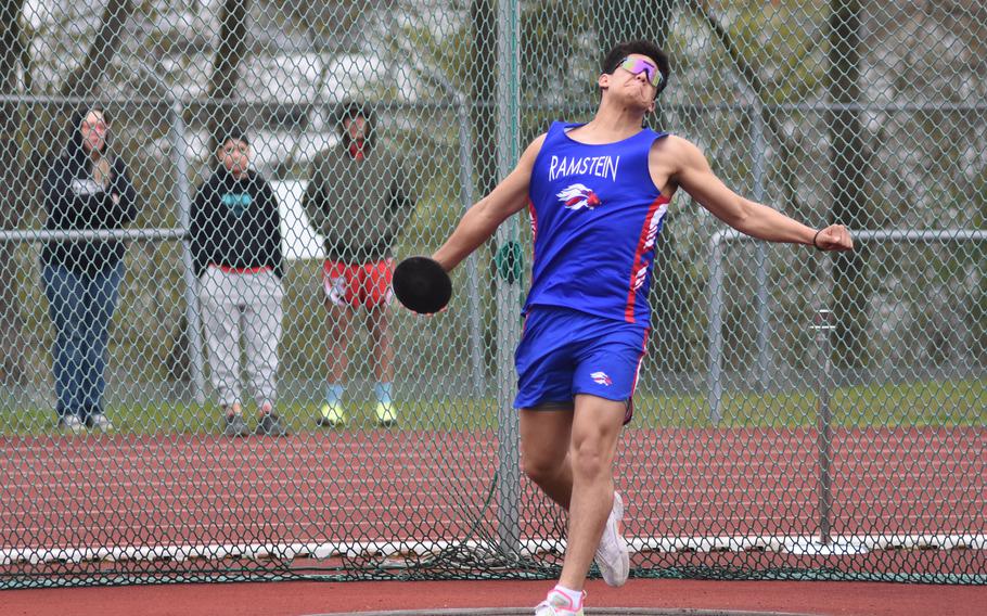 Ramstein freshman Javier Harrington slings the discus at the DODEA-Europe track and field meet at Wiesbaden High School, Germany, on Saturday. Harrington went on to win the discus and shot put, qualifying for Europeans in both events.