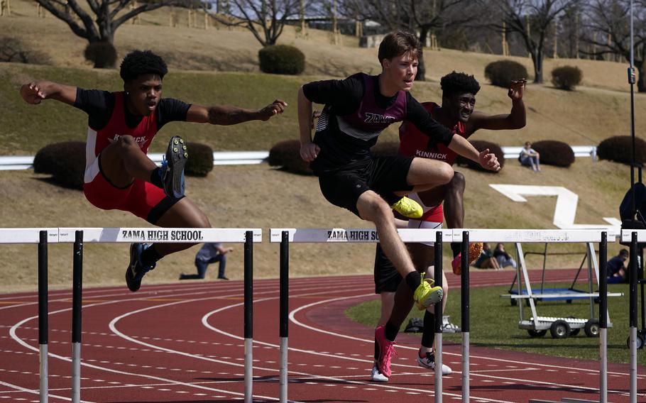 Nile C. Kinnick's Xavier Wright and Kennedy Hamilton negotiate the 110 hurdles alongside Zama's Jayden Steill during Saturday's Japan track meet. Hamilton, on the outside, won the event.
