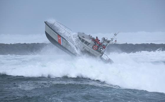 The crew of a vessel from Coast Guard Station Umpqua River, Winchester Bay, Ore., conducts heavy-weather surf training in the bay on March 15, 2022.  