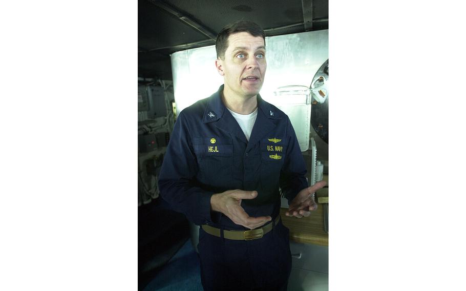 Capt. Tom Hejl, USS Kitty Hawk commanding officer, speaks with reporters on his ship’s bridge Monday, April 15, 2002.