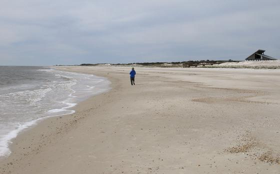 Miles of empty beach and billions of sea shells await a lone beachcomber at St. George Island State Park near Apalachicola in the Florida Panhandle, Feb. 5, 2007. The nine-mile stretch of Florida sugar-white sand in an unspoiled natural setting alongside the Gulf of Mexico is the nation's best beach for 2023, according to the annual ranking released May 18 by the university professor known as “Dr. Beach.”