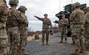 Staff Sgt. Elijah Bentz, master gunner for Alpha Battery, 5th Battalion, 4th Air Defense Artillery Regiment, speaks to troops in Andoya, Norway, on May 8, 2025, ahead of a live-fire drill that was part of NATO's Formidable Shield exercise.
