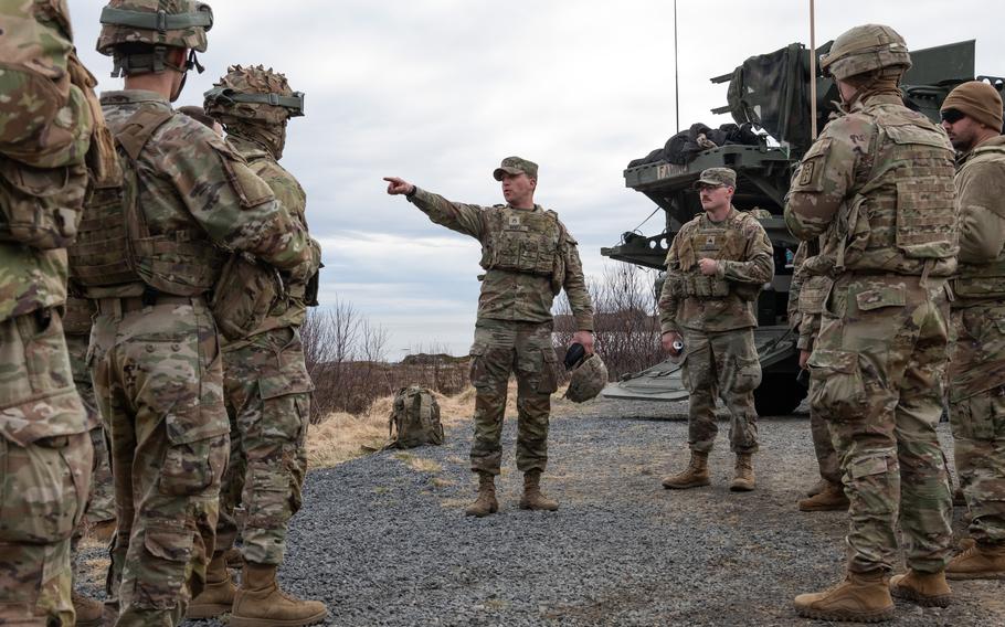 Bentz points his finger as troops gather around.