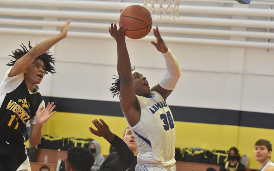 Rota's Kennith Bryant loses control of the ball after getting by Vicenza's Jayden Reed on his way to the basket Friday, March 4, 2022 at the DODEA-Europe Division II basketball championships.