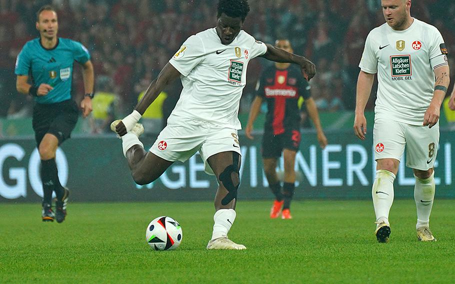 Ache Ragnar takes a shot in the German cup final in Berlin Saturday night as FCK captain Jean Zimmer watches.