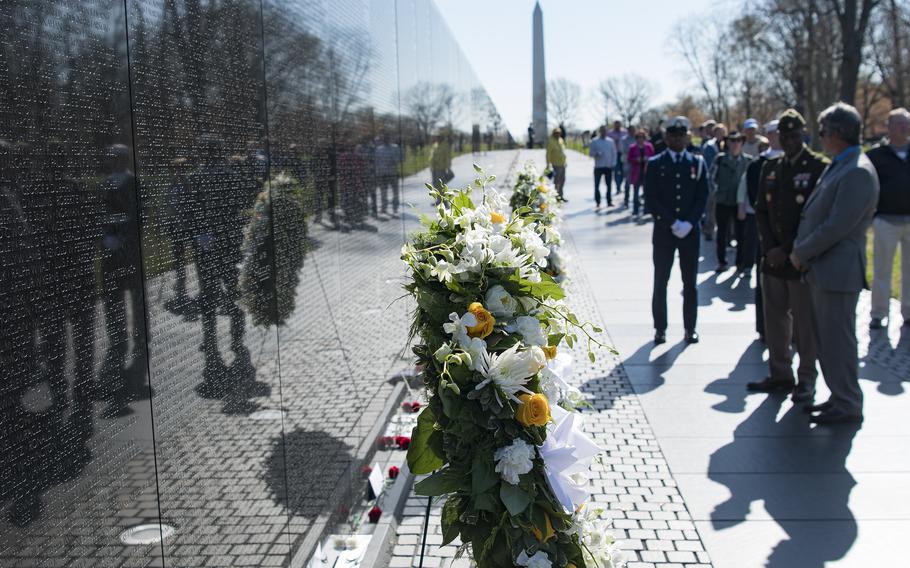 Ronnie BoisClaire and the Senior Enlisted Advisor to the Director of the Defense POW/MIA Accounting Agency Sgt. Maj. Anthony Worsley attend a silent wreath laying ceremony at the Vietnam Veterans Memorial in Washington, D.C., on Wednesday, March 29, 2023, to commemorate National Vietnam War Veterans Day.