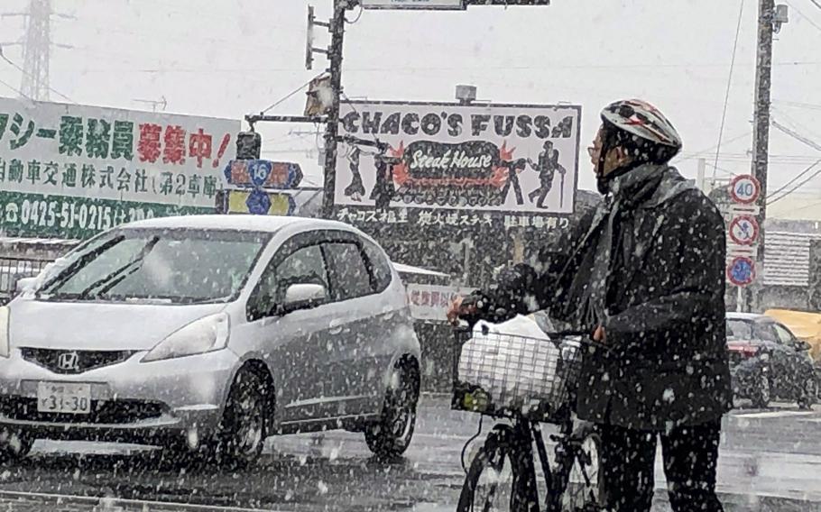 Afternoon snowfall hampers visibility outside Yokota Air Base, Japan, Monday, Feb. 5, 2024.