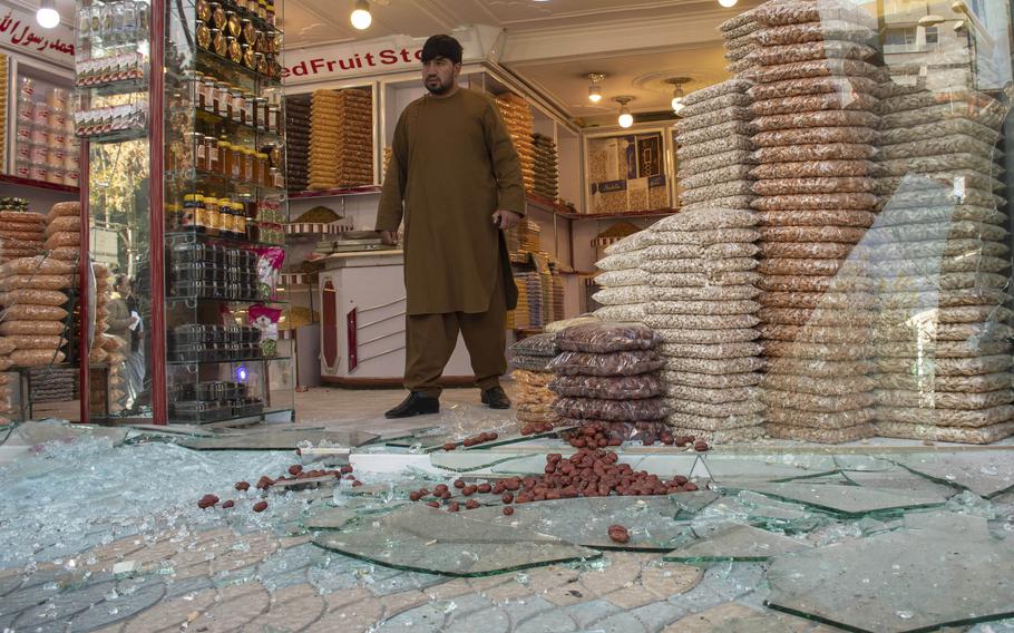 A man exits a shop damaged by rocket fire in Kabul, Afghanistan, in 2020. A U.S. humanitarian program to aid Afghan war victims will close at the end of June, the State Department said recently. 