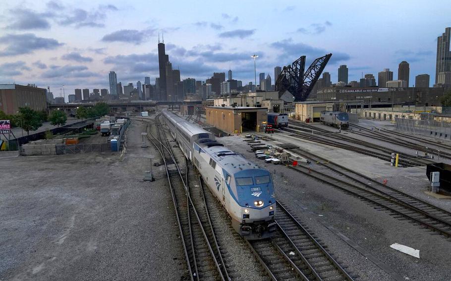 An Amtrak passenger train departs Chicago in the early evening headed south on Sept. 14, 2022, in Chicago. 