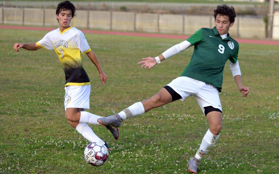 Kubasaki's Matthew Yulee tries to settle the ball against Kadena's Tuck Renquist during Wednesday's Okinawa boys soccer match. The Panthers won 3-2.