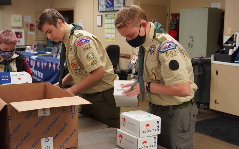 Boy Scouts assemble care packages for overseas troops at a VFW post in Mechanicsburg, Va., in November. The pandemic’s disruption of the global supply chain is making it more challenging to obtain items for care packages and send them to bases abroad.